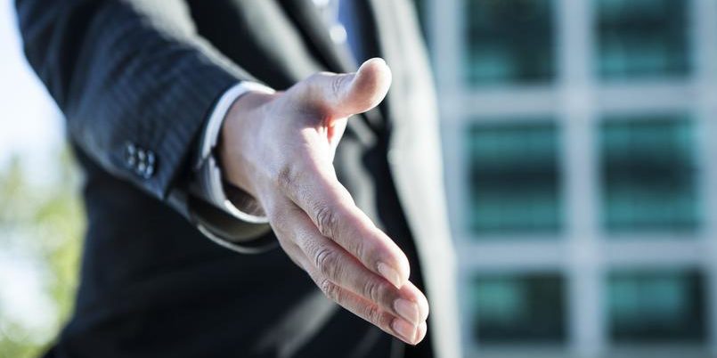 Businessmen are giving out their hands